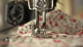 Close up on a sewing machine vintage showing process.
