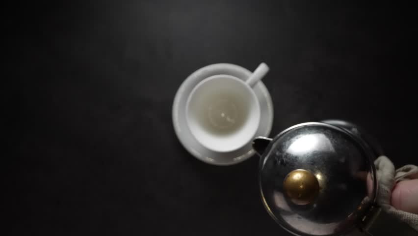 Pouring coffee into the cup