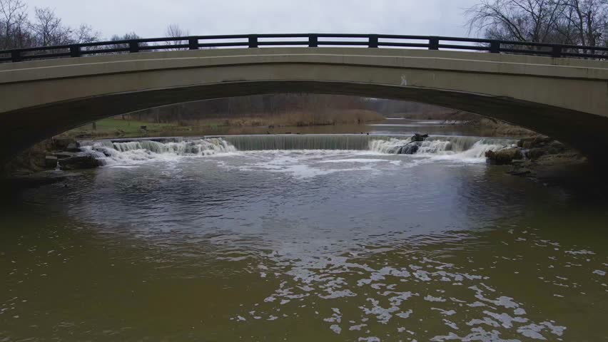 Berea, Ohio Metroparks bridge with small waterfall heading south.