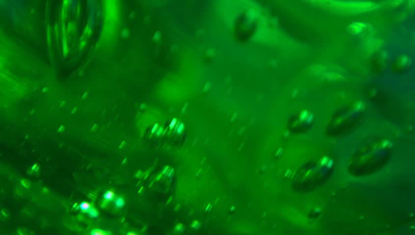 Extreme macro of bubbles in green jello cream (gel). Royalty-Free Stock Footage #3421010