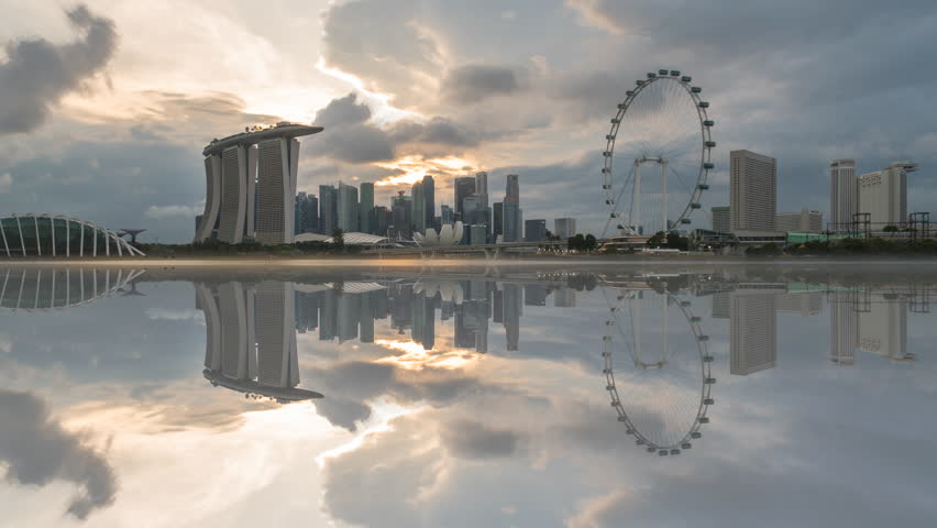 4k time lapse of sunset day to night scene at Marina Bay Singapore city skyline with reflection effect. Zoom out Royalty-Free Stock Footage #3421030769