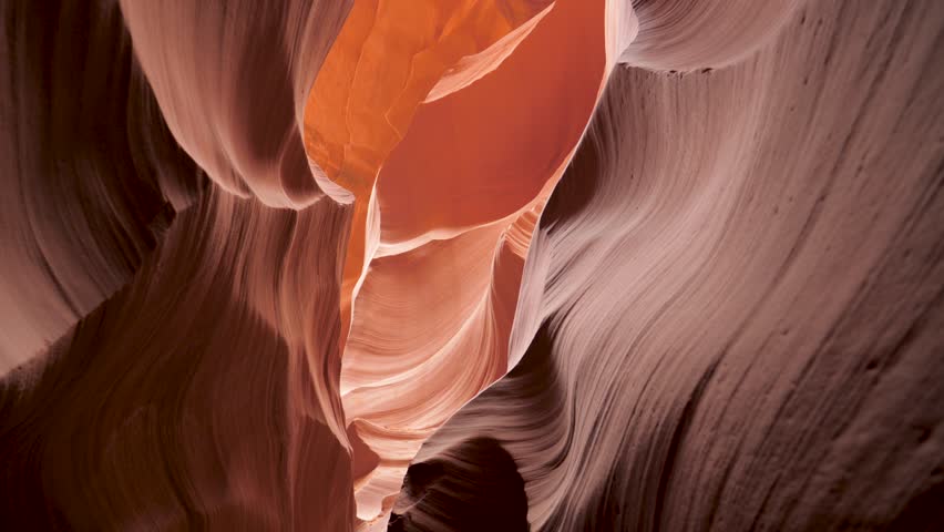 Movement in deep slot canyon with curved and smooth sandstone massive vertical walls of bright red orange color, amazing rock formations antelope canyon, fantastic place to hiking tourist in usa park Royalty-Free Stock Footage #3421076207