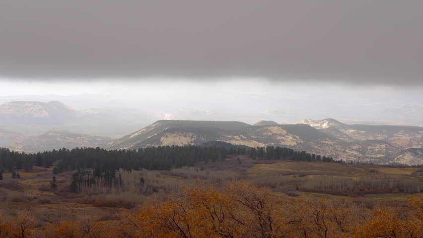 Establishing shot of mountains with fog and clouds at Homestead Overlook, Dixie National Forest, Utah, North America. Day time. ProRes 422 HQ.
