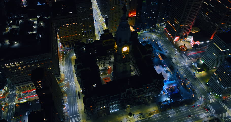 Highlighted building from outside and inside with a clock tower. Aerial view on the City Hall in Philadelphia, Pennsylvania, USA.