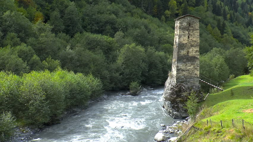 Watch medieval tower on the riverbank. Svaneti. Georgia. Medieval tower built for defensive purposes. Each family had its own tower.
