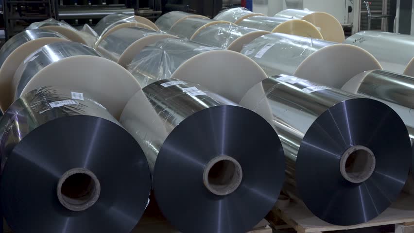Foil in large rolls. Large bobbins with foil inside printing house Royalty-Free Stock Footage #3421459193
