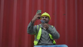 Workers use mobile phones to make video calls and show their wages.
