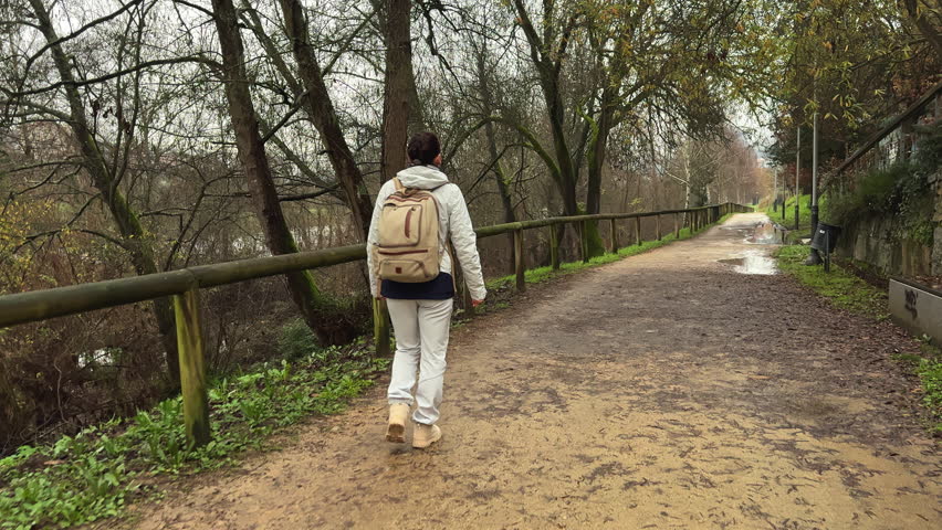 Wanderlust Whispers: Contemplative Stroll by the Riverside