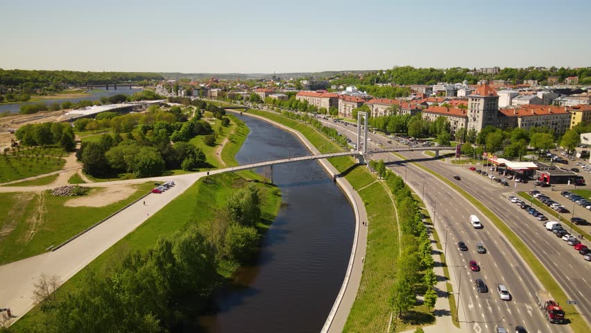 A beautiful view of a river near a road and buildings in Kaunas, Lithuania Royalty-Free Stock Footage #3421801521
