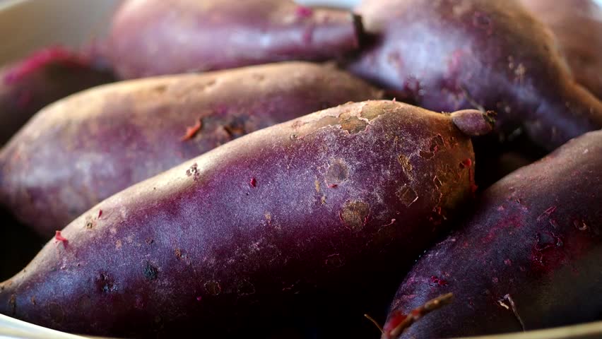 Steaming sweet potatoes in pot, in studio Chiangmai Thailand.