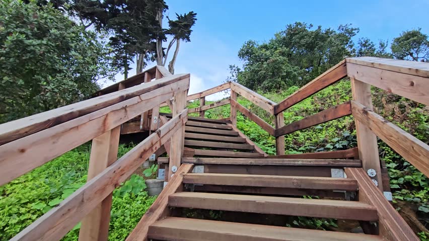Wooden stairs in the street. Descent to the bay.