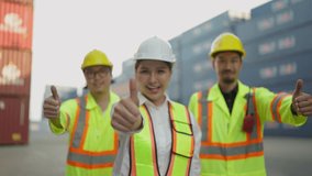 Portrait team of industrial engineer workers standing and giving thumbs up smiling, looking at camera. Warehouse workers thumbs up to appreciate success of teamwork. Teamwork concept - Powered by Shutterstock - Get 15% off with code: PIKWIZARD15