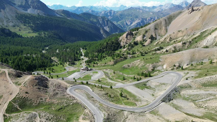 Scenic Road with Hairpin turns at Col Izoard Mountain Pass in French Alps, France - Aerial 4k Royalty-Free Stock Footage #3422058519