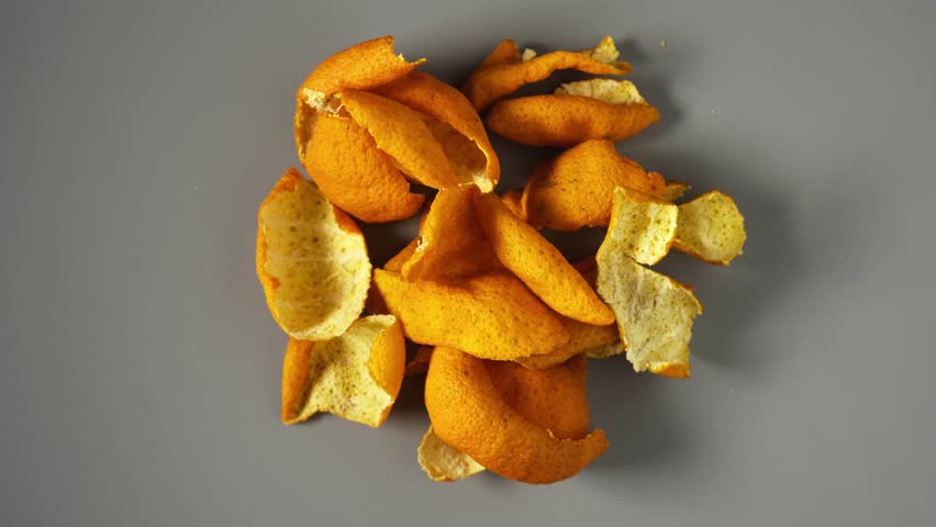 Dried peel of tangerines, close-up. 4K Video, rotating. Chinese herbal medicine. Dried tangerine or orange peel used for remedy tinctures and hot tea drinks.