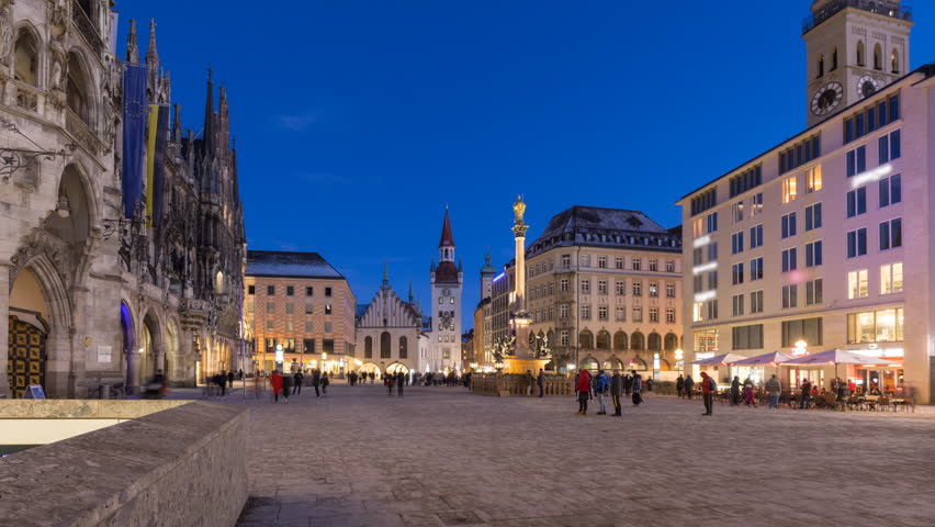 Munich Marienplatz sqaure at night time lapse, hyperlapse footage video fo Munich main sqaure people walking at night in front munich town hall. Royalty-Free Stock Footage #3422155191