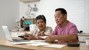 Handheld medium shot, Happy Asian senior couple use technology device to working with laptop computer and digital tablet at home, They are discussion to planning and check on calendar paper together - Powered by Shutterstock - Get 15% off with code: PIKWIZARD15