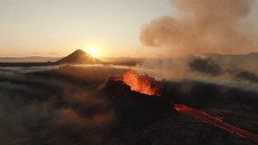Fagradalsfjall volcano eruption Iceland 2023, aerial drone view of the crater spitting lava during sunrise with mountains in the background - Powered by Shutterstock - Get 15% off with code: PIKWIZARD15