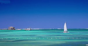 Sailing catamaran boat and yacht in caribbean sea water during sunny day, tropical summer vacation 4k Video