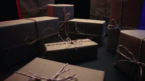 Gift boxes wrapped in craft rustic paper. Recycle packaging, macro holiday background. Surprises, seasonal content. - Powered by Shutterstock - Get 15% off with code: PIKWIZARD15