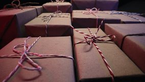 Gift boxes wrapped in craft rustic paper. Recycle packaging, macro holiday background. Surprises, seasonal content. - Powered by Shutterstock - Get 15% off with code: PIKWIZARD15