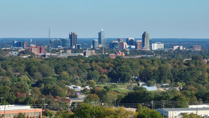 Raleigh, North Carolina skyline from a distance. Aerial with zoom lens.