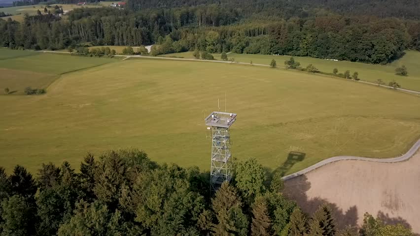 A drone orbits the Gehrenbergturm lookout tower near Lake Constance