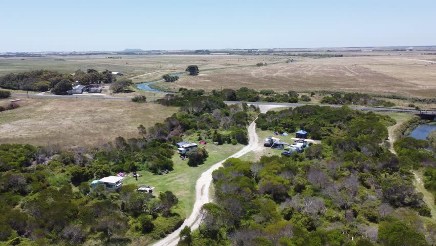 A nice creek going into the ocean with a bridge and campsite nearby. Called eight mile creek and is in South Australia near Port Macdonnel