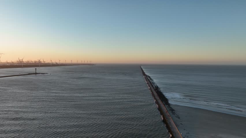 Hoek van Holland coastal town in South Holland, located on the north bank of the Nieuwe Waterweg where it reaches the North Sea. Next to the port of Rotterdam, coastline aerial view.