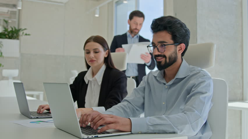 Corporate work multiracial coworkers woman man typing laptops in office happy businessman ceo congratulate employees achieving good result celebrate successful deal business team colleagues rejoicing Royalty-Free Stock Footage #3422508019