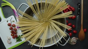 Spaghetti pasta in the pot on the kitchen table - Powered by Shutterstock - Get 15% off with code: PIKWIZARD15