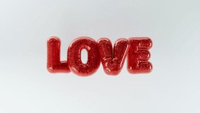 3D animation of LOVE letters in the form of inflated balloons hanging in the air with red glitter material on light background, 4K animated valentine's day template - Powered by Shutterstock - Get 15% off with code: PIKWIZARD15