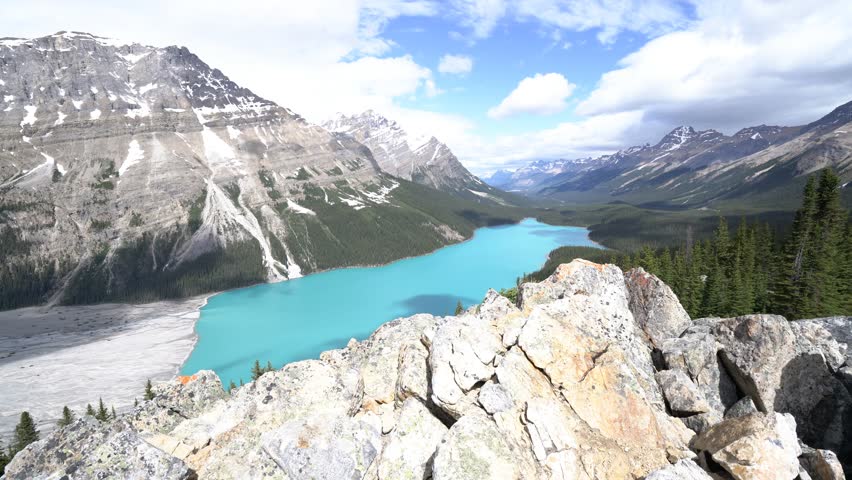 Young couple hiking in Banff national park consulting trail map for directions. On top of Peyto lake, Alberta, Canada
People travel outdoor pursuit concept