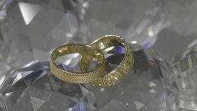 Jewelry made of precious metals. Close-up - wedding rings. Horizontal high quality Full HD video. Cutaway for video editing. Game of light on rings.