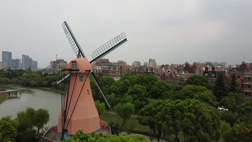 Windmill with Skyline and Canal Little Amsterdam Shanghai China Pudong Drone Aerial Shot
