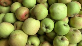 4k video of group of green apples in a local market. Food and fruit concept.