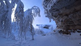 Stone Town in winter in the Perm region. Frozen snow-covered winter forest, deeply covered with snow in sunlight. Forest in the snow. Snowy winter. Trees in the snow in the Stone City. Russia. 4К