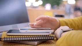 Young woman using smartphone at mall. Caucasian girl looking at mobile phone. Communication, work or study, connection, mobile apps, technology, lifestyle concept 4K - Powered by Shutterstock - Get 15% off with code: PIKWIZARD15
