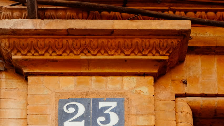 Number 23 (twenty-three) affixed to the exterior of a building, with an elegant, vintage and traditional appearance
 Royalty-Free Stock Footage #3422860261