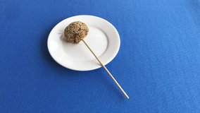 Burmese (Southeast Asia) jaggery lollipop on a plate