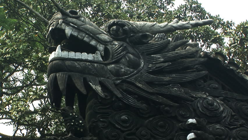 Bronze dragon on top of a garden wall, Yuyuan Garden, Shanghai, China, zoom out