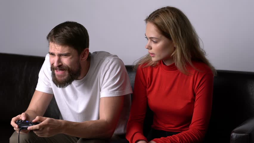 A woman encourages a man to play