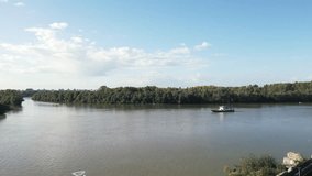 Aerial capture of Sava and Danube, two large European rivers meet in Belgrade, Serbia. Picturesque drone video of river confluence.