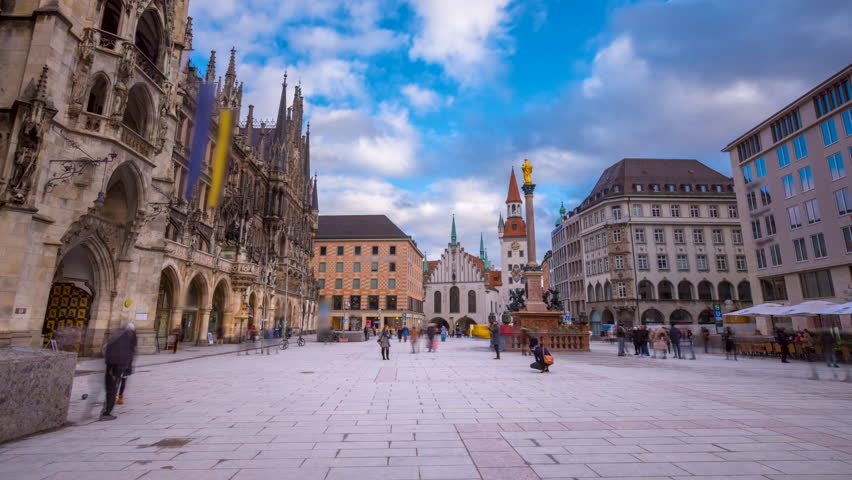 Beutiful view of Tourists at the Marienplatz street in Munich view in front of Town Hall. The Marienplatz is central square in the city centre of Munich, Germany. Hyperlapse footage. Marienplatz. Royalty-Free Stock Footage #3423269935