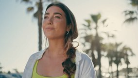 Joyful girl crossing tropical avenue closeup. Happy relaxed lady looking camera walking at palm trees alley portrait. Carefree woman enjoying summer relaxing at sunny street. Paradise vacation concept - Powered by Shutterstock - Get 15% off with code: PIKWIZARD15