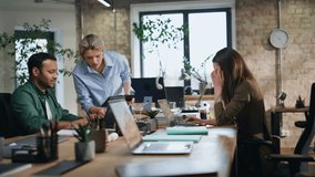 Woman mentor looking in laptop male intern sitting at company coworking space. Serious female coach explaining mistakes in colleague work. Busy indian man manager dissatisfied with boss remark. - Powered by Shutterstock - Get 15% off with code: PIKWIZARD15