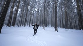 Man dancing in winter forest. Media. Stylish man moves like in clip in winter forest. Shooting clip of rapper dancing in winter forest