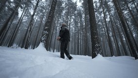 Man raps in winter forest. Media. Stylish man moves in hip hop style in winter forest. Man reads hip hop in winter forest