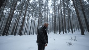 Man dancing in winter forest. Media. Stylish man is rapping in winter forest. Shooting music video with rapper in winter forest