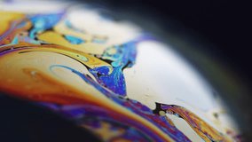 Paint blend. Holographic sphere. Defocused blue orange color stain bubble oil fluid ink mix wave motion marble texture on dark black abstract art background. - Powered by Shutterstock - Get 15% off with code: PIKWIZARD15