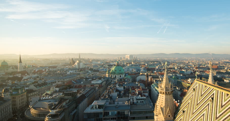 VIENNA, AUSTRIA – DECEMBER 2015 : Timelapse over central Vienna from St Stephens Cathedral at sunset with light changing and cityscape in view Royalty-Free Stock Footage #34233946